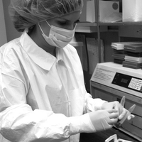 Dr. Charla Marshall, doing ancient DNA work. Note the protective clothing designed to minimize risk of contamination from modern DNA.